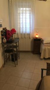 A bed or beds in a room at Affittacamere Mirella