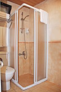a shower stall in a bathroom with a toilet at Yaman Life Hotel in Alanya