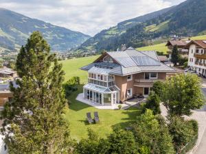 an aerial view of a house with solar panels on it at Villa Heimatliebe in Ramsau im Zillertal