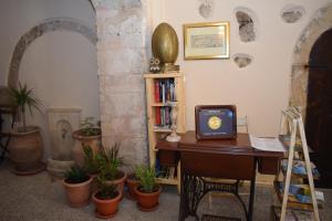 a room with a desk with a computer on it at Loggia Traditional Suites in Rethymno Town