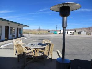 a table with two chairs and a street light at Alamo Inn in Alamo