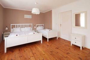 Postel nebo postele na pokoji v ubytování Apartmány Rossini