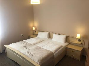 Postel nebo postele na pokoji v ubytování Apartmány Rossini