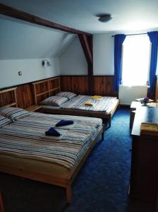 Postel nebo postele na pokoji v ubytování Penzion U Lucerny s malou farmičkou