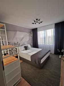 Ένα ή περισσότερα κρεβάτια σε δωμάτιο στο Cliché Luxury Apartment