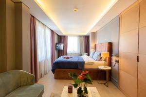 Ένα ή περισσότερα κρεβάτια σε δωμάτιο στο Malta Bosphorus Hotel