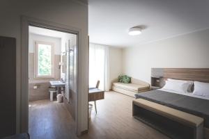 Postel nebo postele na pokoji v ubytování Hotel Residence Vallecorsa