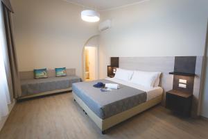 Postel nebo postele na pokoji v ubytování Hotel Residence Vallecorsa