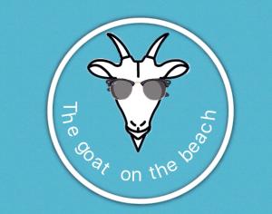 a sticker with a goat with sunglasses on it at the goat on the beach in Scilla