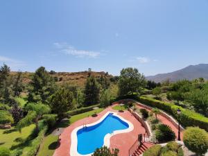 an overhead view of a swimming pool in a park at Vista Alhaurin Golf in Alhaurín el Grande