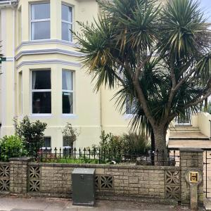 a palm tree in front of a building at The Ashleigh in Paignton