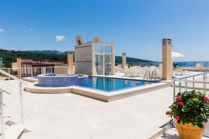 a swimming pool on the roof of a building at Sky Fort Apartments in Dobra Voda