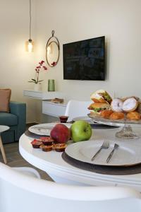 a table with plates of food on top of it at Under the Aqueduct boutique house in Kavála
