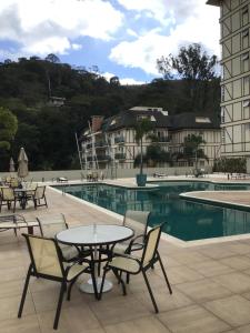 The swimming pool at or close to Flat Itaipava - Granja Brasil