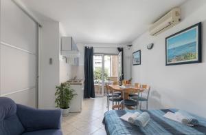 a living room with a bed and a table at Apartments Barba in Tučepi