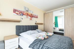 Posteľ alebo postele v izbe v ubytovaní Kasprowicza 20 Uzdrowisko by Jantar Apartamenty Kołobrzeg
