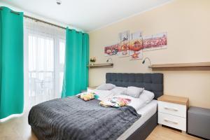Posteľ alebo postele v izbe v ubytovaní Kasprowicza 20 Uzdrowisko by Jantar Apartamenty Kołobrzeg