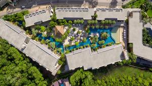 an overhead view of a mansion with a swimming pool at Rawai Palm Beach Resort - SHA Extra Plus in Rawai Beach
