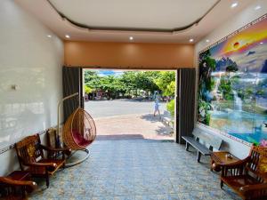 a room with chairs and a large painting on the wall at Thuy Thanh Hotel in Con Dao +89 photos