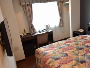 Ένα ή περισσότερα κρεβάτια σε δωμάτιο στο Yokohama Mandarin Hotel