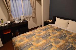 Ένα ή περισσότερα κρεβάτια σε δωμάτιο στο Yokohama Mandarin Hotel