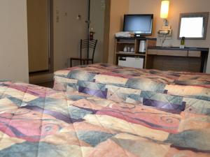 Ένα ή περισσότερα κρεβάτια σε δωμάτιο στο Yokohama Mandarin Hotel