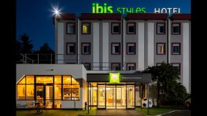 a building with a sign on top of it at Ibis Styles Bobigny Centre Préfecture in Bobigny
