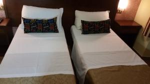 Postel nebo postele na pokoji v ubytování Hotel Chopin