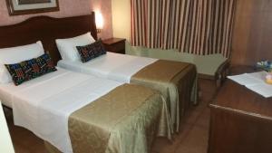 Postel nebo postele na pokoji v ubytování Hotel Chopin