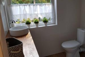 Kúpeľňa v ubytovaní NADMORSKIE Chwile - Apartament + 8 fotografií