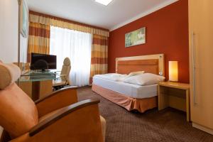 TV o dispositivi per l'intrattenimento presso Active & Wellness Hotel Subterra