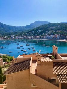 a view of a harbor with boats in the water at Hartmut Friedrich Apartment Port de Soller in Port de Soller