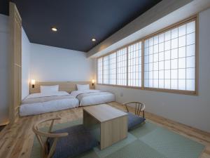 Postel nebo postele na pokoji v ubytování Tosei Hotel Cocone Asakusa Kuramae