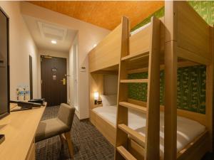 Postel nebo postele na pokoji v ubytování Tosei Hotel Cocone Asakusa Kuramae