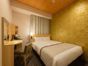 Postel nebo postele na pokoji v ubytování Tosei Hotel Cocone Asakusa Kuramae