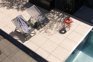 The swimming pool at or close to GOING TRIPLE A apartments EAST