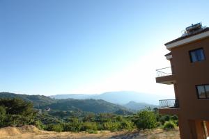 a view of the mountains from a building at Ilioni Cottage by AgroHolidays in Kyperounda