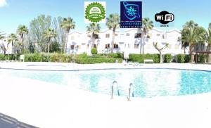 a large swimming pool in front of a building at Port Aventura, Exclusivo Alojamiento La Pineda in La Pineda