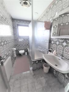 a bathroom with a sink and a shower and a toilet at Birkenhof in Millstatt +45 photos