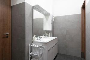 a bathroom with a sink and a mirror at Vajda 15 Hostel Budapest in Budapest +16 photos