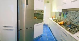 A kitchen or kitchenette at VILLA MARINA PICCOLA ai FARAGLIONI