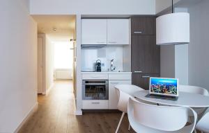 A cozinha ou cozinha compacta de Brera Serviced Apartments Frankfurt Oper mais 18 fotos