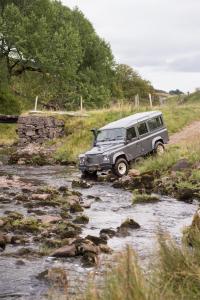 a jeep parked in a stream in a field at The Gleneagles Hotel in Auchterarder