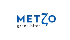 a logo for mezco greek bites at Porto Galini Seaside Resort & Spa in Nikiana
