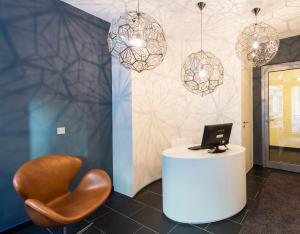 Uma TV ou centro de entretenimento em Brera Serviced Apartments Frankfurt Oper