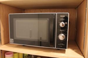 Eldhús eða eldhúskrókur á plat hostel keikyu haneda home