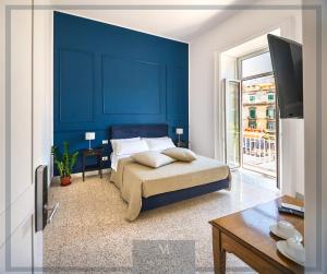 A bed or beds in a room at MONART HOSPITALITY Cavour