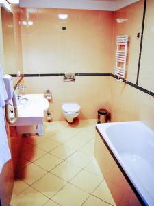Kúpeľňa v ubytovaní Hotel Zamek Królewski w Rydzynie