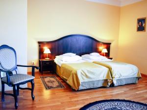 Posteľ alebo postele v izbe v ubytovaní Hotel Zamek Królewski w Rydzynie