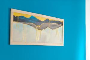 a painting with icicles hanging on a wall at Globo - self check-in hostel in Šibenik